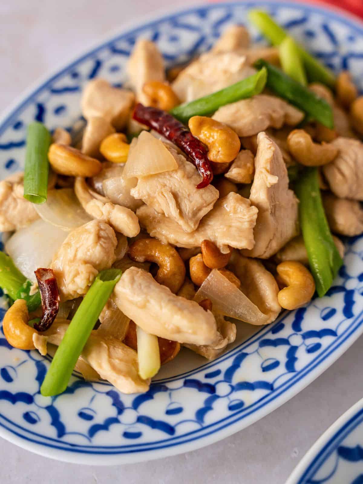 Up close view of cashew chicken on a plate.
