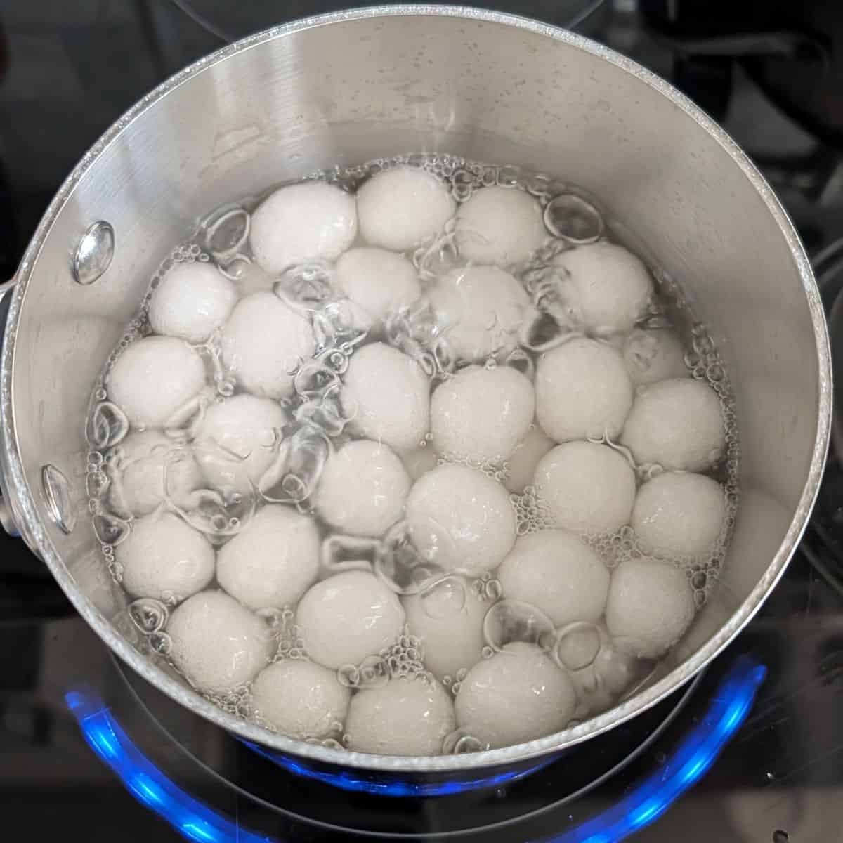 Tapioca balls boiling in water.