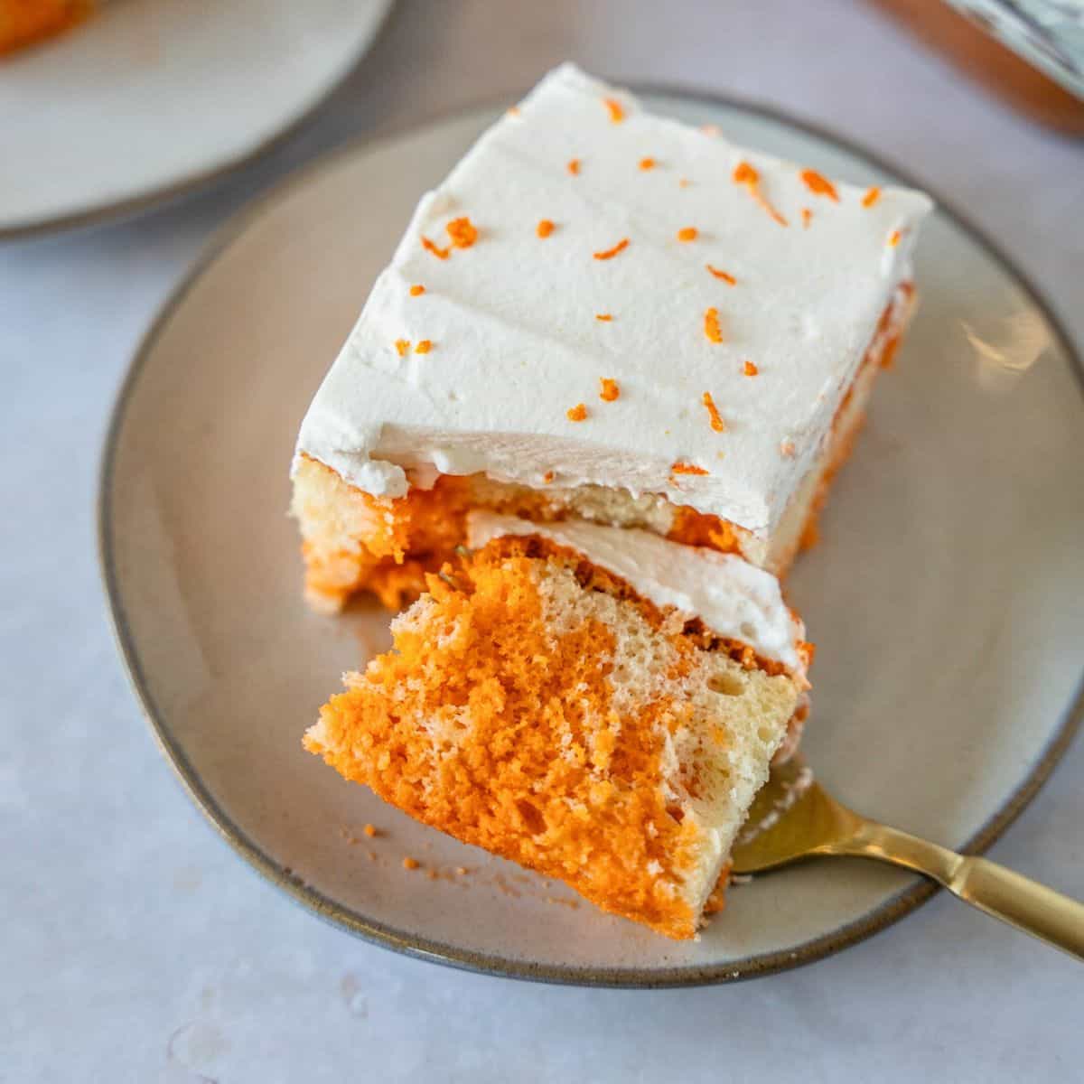 Feature image of Thai tea tres leches cake with a piece on a fork.