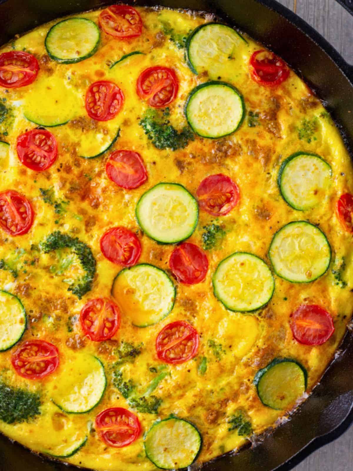 Overhead view of frittata in a cast iron skillet.
