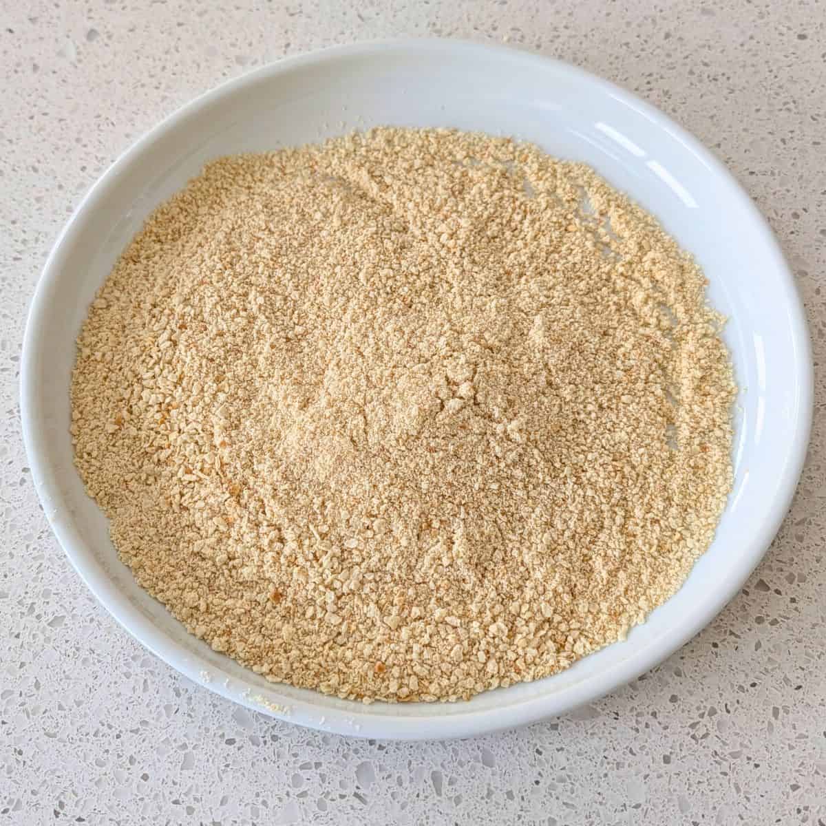 Blended breadcrumbs on a plate.