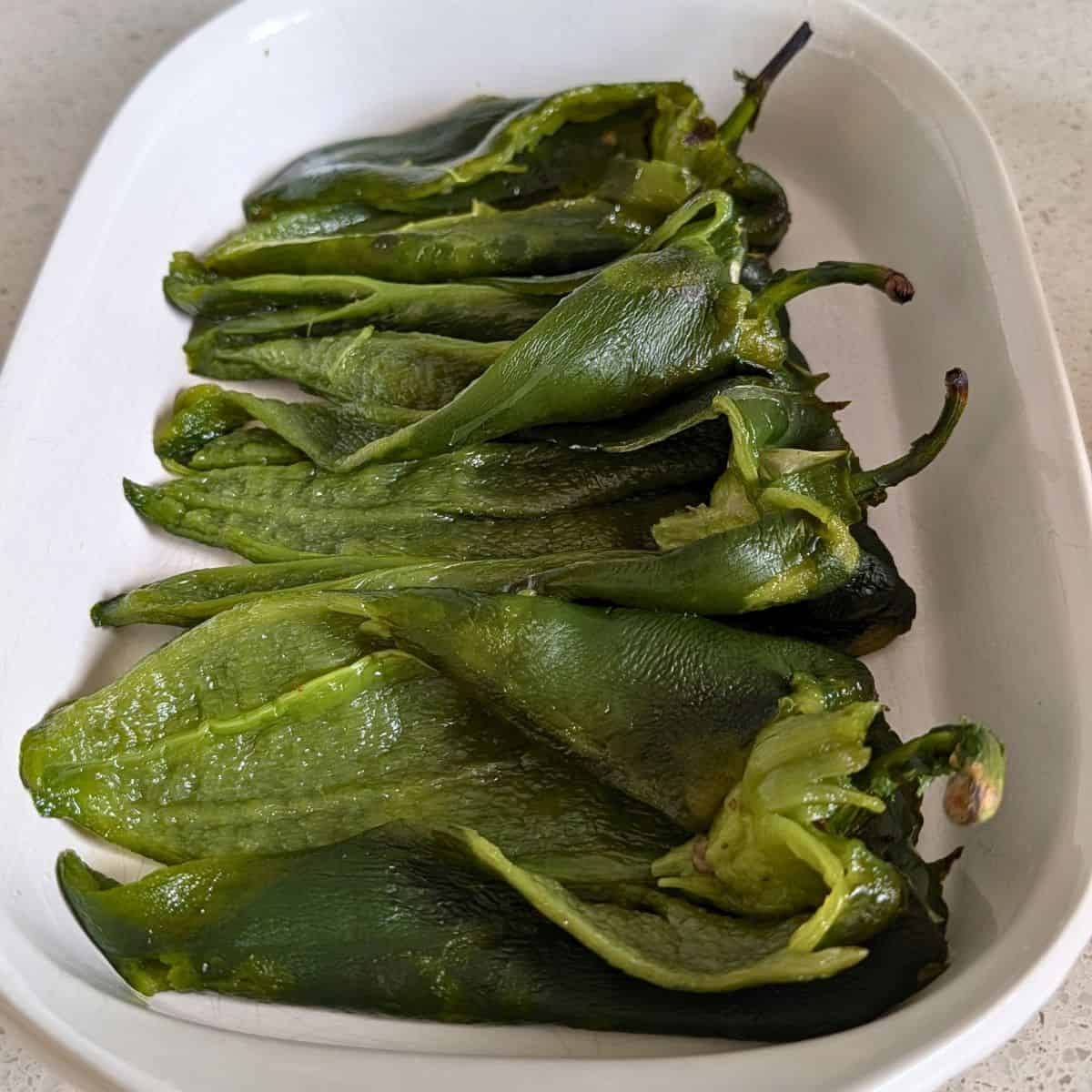 Roasted poblano peppers peeled and prepared for baked chile rellenos.
