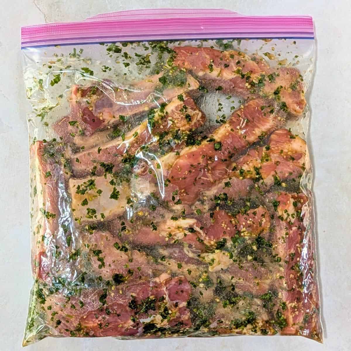 Ribs marinating in plastic zip top bag.