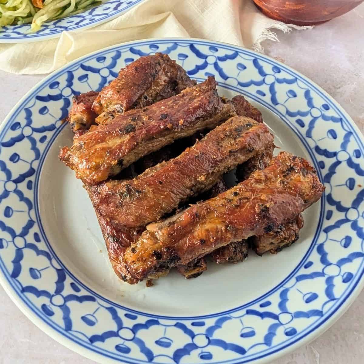 Feature image of Thai ribs on a blue plate.