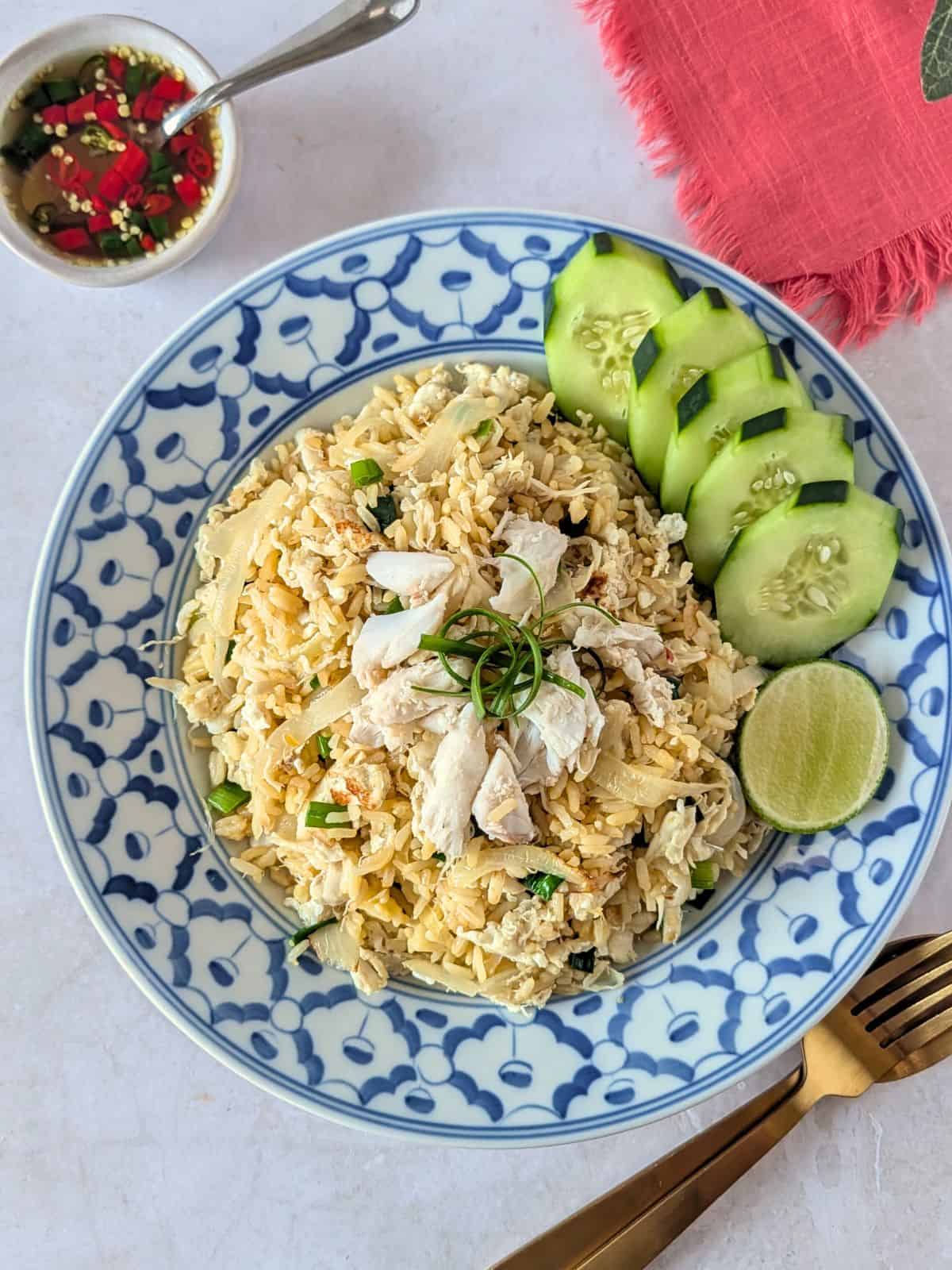 A close up shot of crab fried rice on a plate.