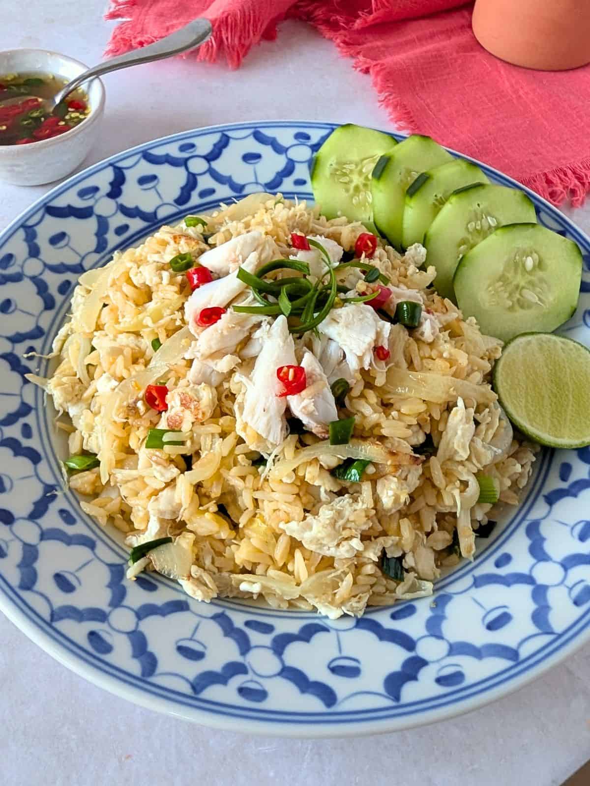 A close up shot of crab fried rice on a plate.