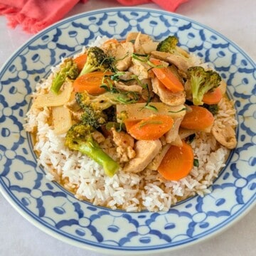 Feature image of Thai red curry chicken over a plate of rice.